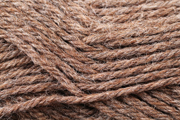 A super close up image of earth tone yarn