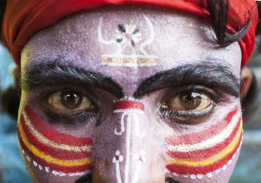 Close view of an Indian man with painted face