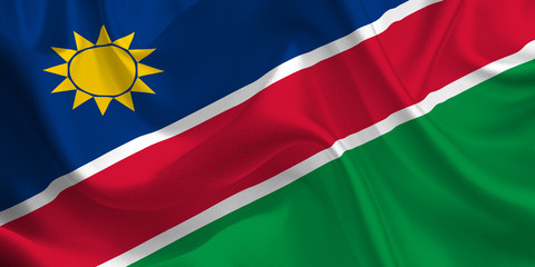 Obraz premium Waving flag of the Namibia. Flag in the Wind. National mark. Waving Namibia Flag. Namibia Flag Flowing.