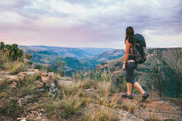 Hiker walking on a scenic mountain trail
