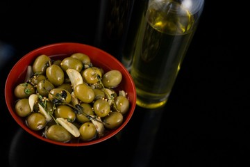 Close-up of marinated olives with olive oil and balsamic vinegar