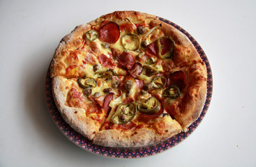 Pizza with topping Smoked Beef, Onion, Green Pepper, and Mozzarella Cheese.