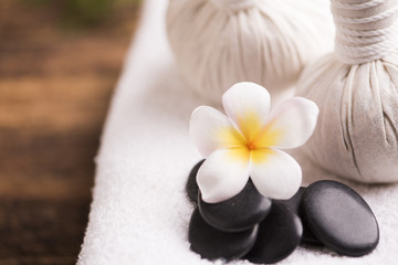 Spa stones with towel and plumeria