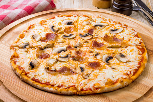 Pizza with Parma and mushrooms