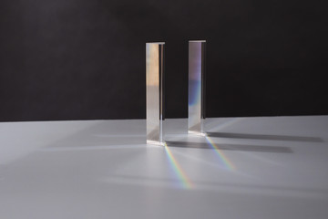 Two glass prisms splitting light...