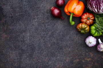 Fresh seasonal vegetables on dark rusty table