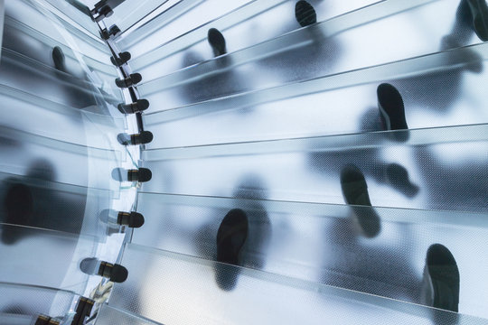 Many people on glass steps