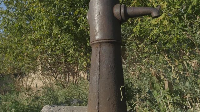 Village life. Water column in the village. Rusty water column, water-pump. Closeup.
