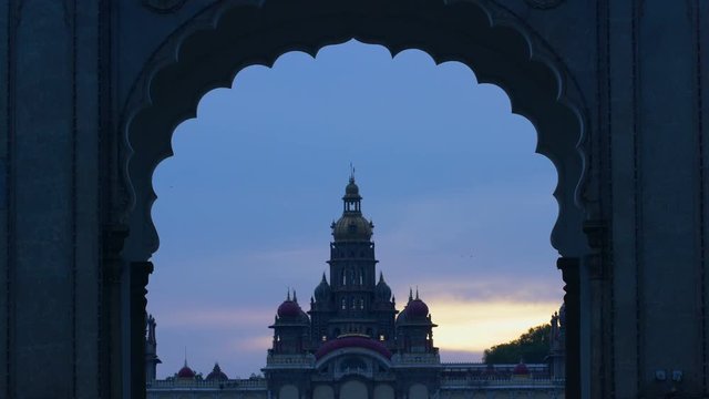 View of Mysore palace through the entrance arch, during dusk