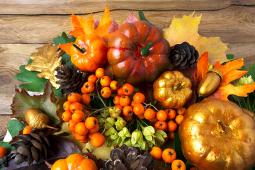 Thanksgiving greenery with golden pumpkins and acorns