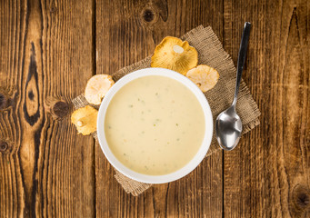 Fresh made Creamy Chanterelle Soup on a rustic background