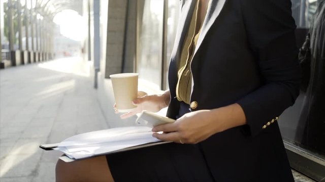  close up of women hends and paper blanks on lap at sun light