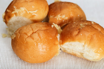 Fresh homemade buns with garlic cooked in the oven. Small round buns with garlic for dinner.