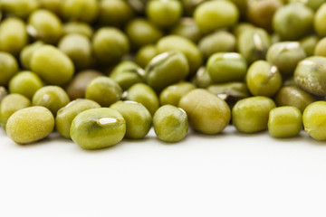 pile of dried mung beans on white background