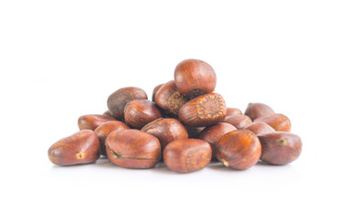 Heap of chestnuts isolated on white background. Selective focus
