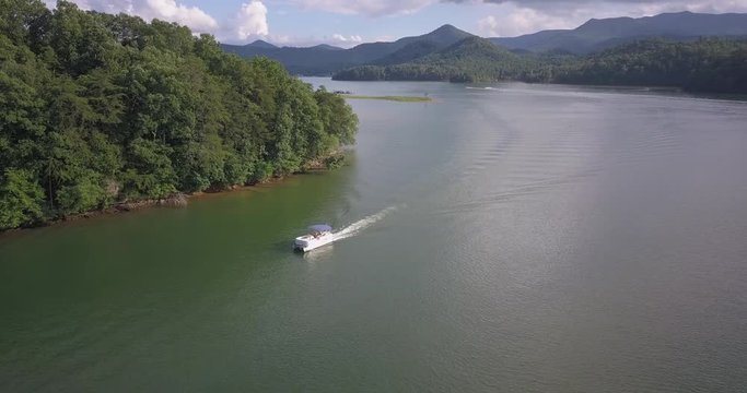 Bird's eye view over Lake Pontoon Boat passing 4k
