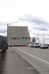 Fototapeta na wymiar Lifted Burnside bridge across Willamette river in Portland Oregon