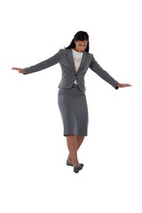 Businesswoman balancing while walking