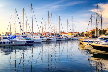 Obraz na płótnie Canvas Harbor with docked boats in Porec town on Adriatic sea in Croatia, Europe.