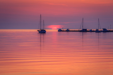 Sunset with silhouettes of ships on the Adriatic sea, The Green lagoon in Porec - Istria, Croatia, Europe.