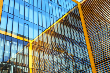 contemporary glass facade with reflection. urban architecture.