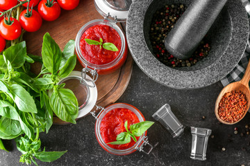 Composition with tasty tomato sauce for pasta on table