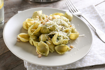 Delicious pasta with pesto sauce on plate