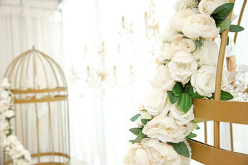 Decorative cage with flowers in wedding hall, closeup