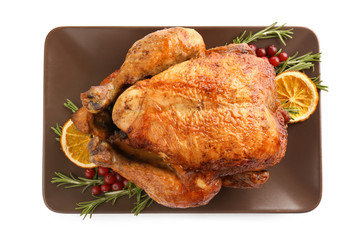Plate with roasted turkey on white background