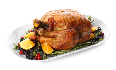 Plate with roasted turkey on white background