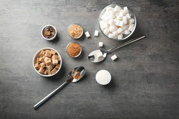 Various kinds of sugar on grey table