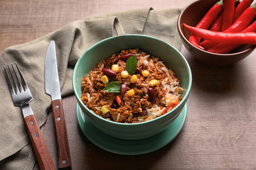 Chili con carne in bowl on table