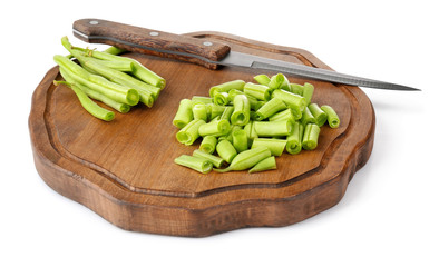 Wooden board with fresh green beans on white background
