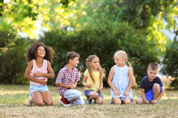 Group of children sitting in park