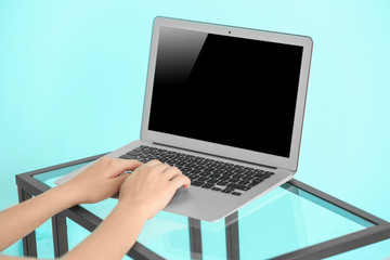 Female blogger working on laptop at home