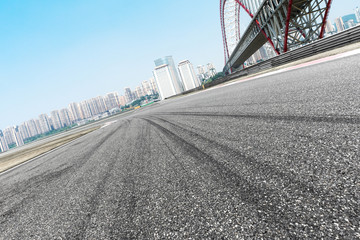 empty asphalt road with cityscape of modern city