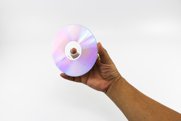 CD-ROM disc with rainbow reflective light on man hand isolated