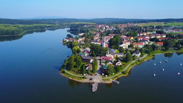 Aerial footage of the town of Frymburk including the Church of Saint Bartholomew, located in south bohemia, Czech Republic.