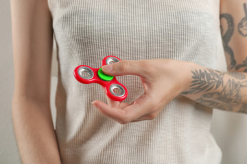 Woman rolling modern spinner indoors