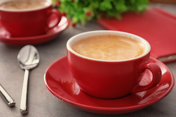 Cup of aromatic morning coffee on table