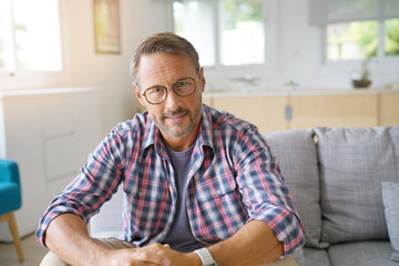 Fototapeta premium Portrait of mature man with eyeglasses looking at camera