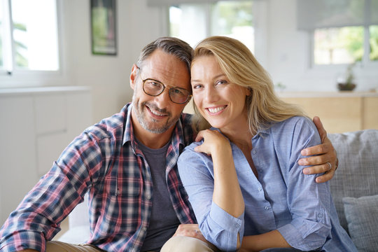 Portrait of mature couple relaxing at home