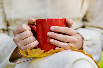 Female hands holds cup of tea closeup