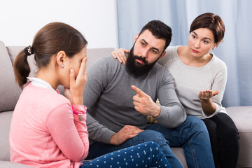 Parents lecturing daughter
