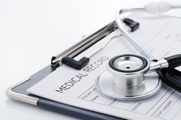 Medical record and stethoscope on white background. Medical examination report. Concept image of result of a medical.
