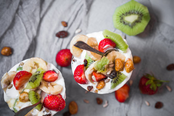 Nutrition Yoghurt fruit dessert strawberries banana kiwi raisins sunflower seeds oatmeal walnuts caramel