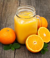 Fototapeta na wymiar Jar with orange juice
