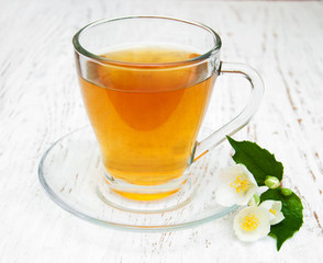 Cup of tea with jasmine flowers