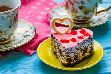 Still life with cup of tea on the wooden background