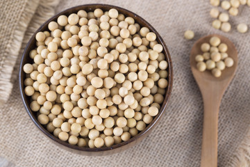 Top view of soy beans in a wooden bowl.